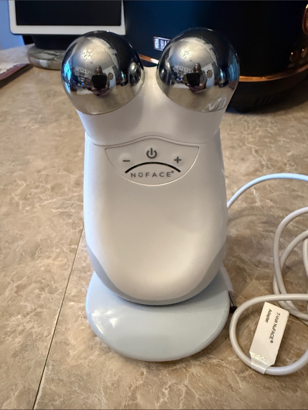 NuFace Microcurrent Facial Toning Device in White with Silver Spheres